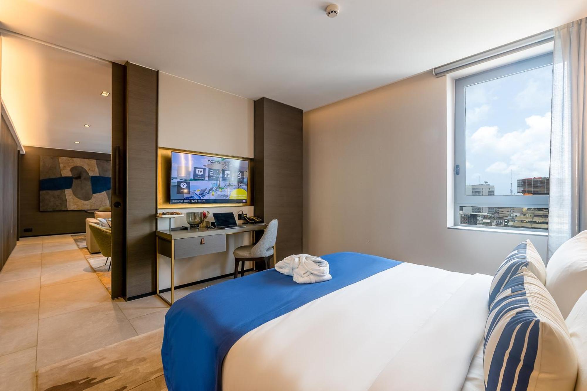 Noom Hotel Abidjan Plateau المظهر الخارجي الصورة A bedroom at the hotel